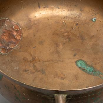 A late 18th or early 19th century bronze and iron pot.