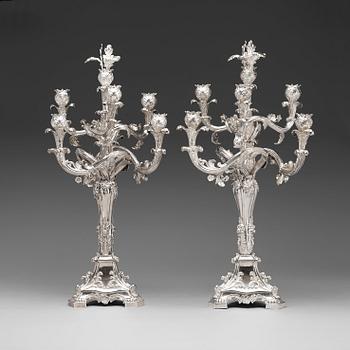 1032. A pair of Swedish 19th century silver candelabras, marks of Gustaf Möllenborg, Stockholm 1845 and 1893.