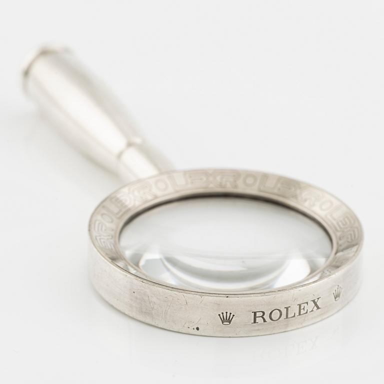 Förstoringsglas, Rolex, 137 x 62 mm.