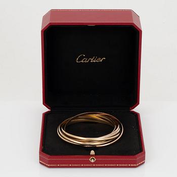 A Cartier "Trinity" bangle with 7 rings.