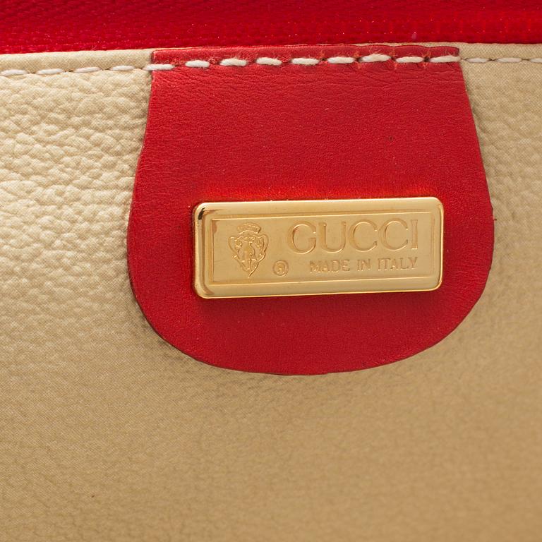 GUCCI, a 'Flora' garment bag.