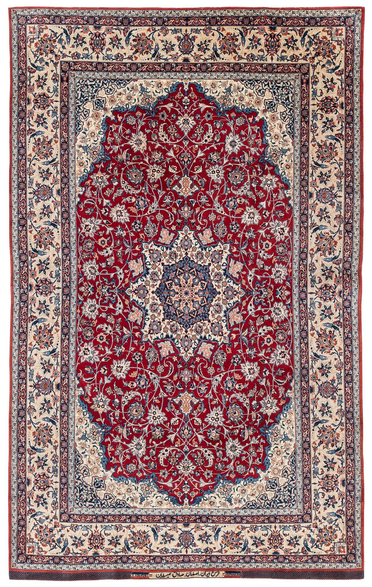 A semi-antique Isfahan rug, Central Persia, signed (Sadegh) Seirafian, c. 237 x 146 cm.