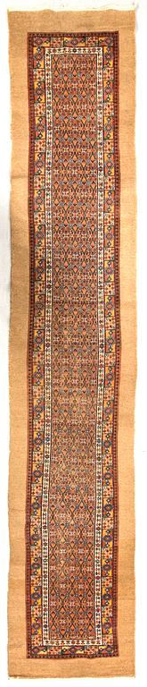 An antique west Persian runner ca 510 x 102 cm.