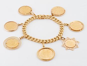 ARMLÄNK med 7 infattade mynt i 14K och 18K guld. Vikt 108,6 gram.
