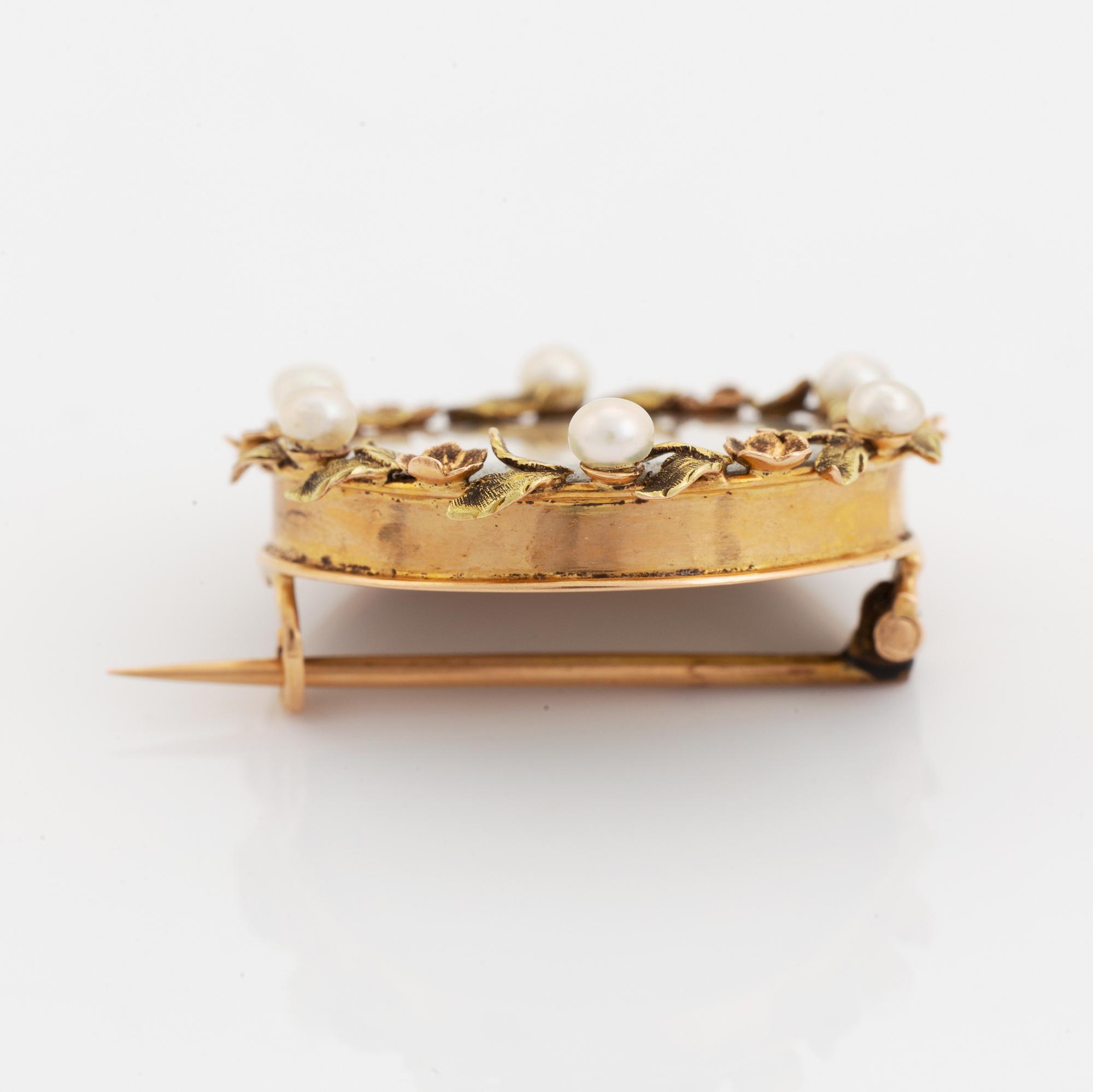 Brooch with miniature portrait on mother of pearl.