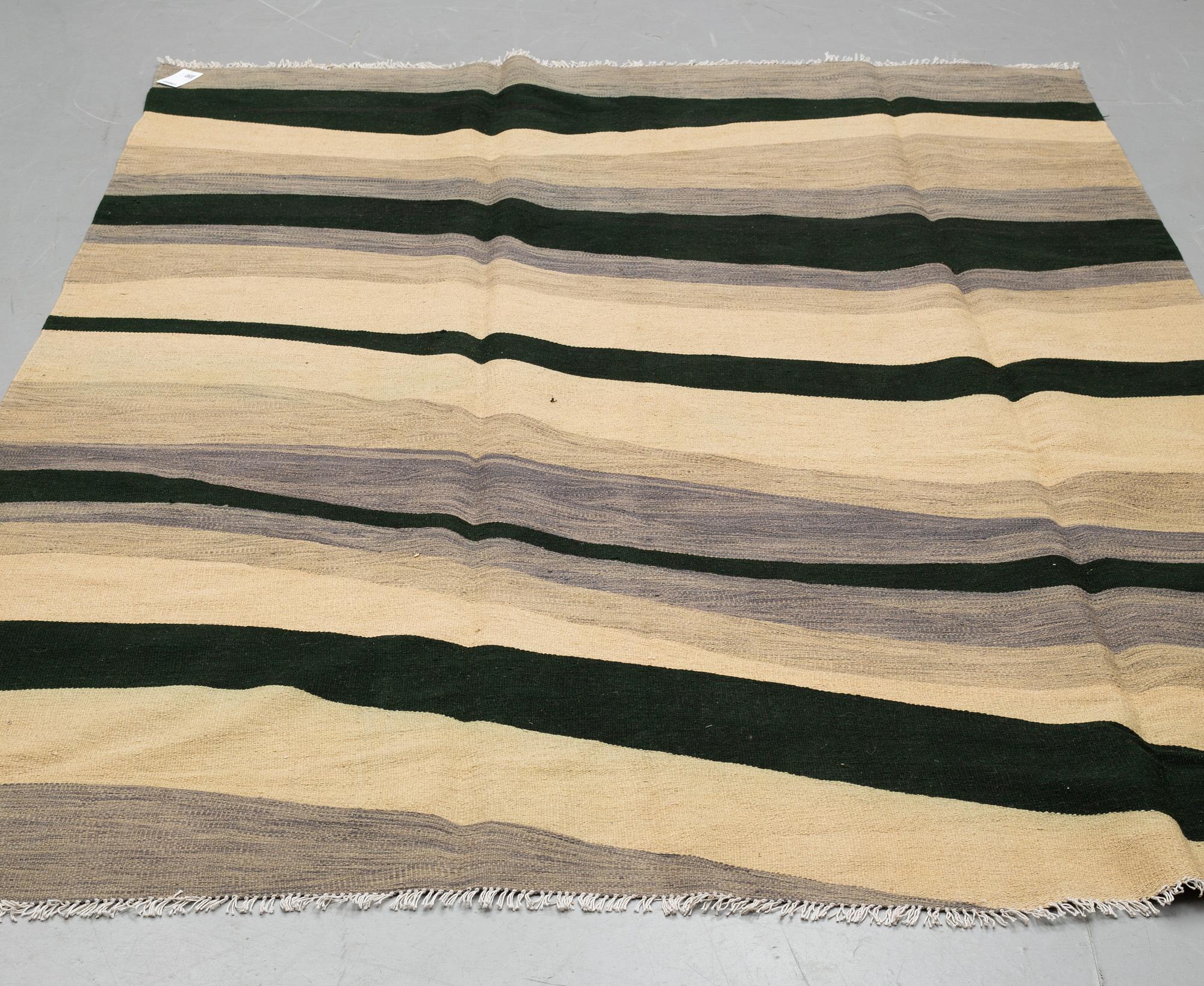 A CARPET, kilim, ca 291 x 197 cm.