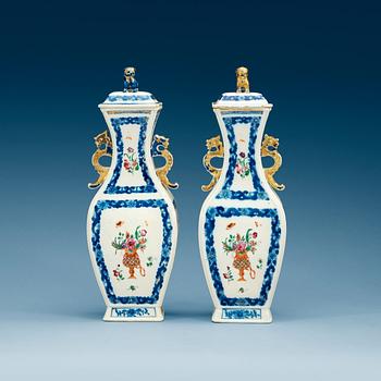 1750. A pair of famille rose vases with covers, Qing dynasty, Qianlong (1736-95).