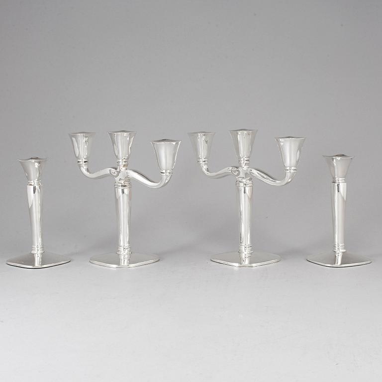 Four (2+2) silver candle holders and candelabras, Germany, 20th century.