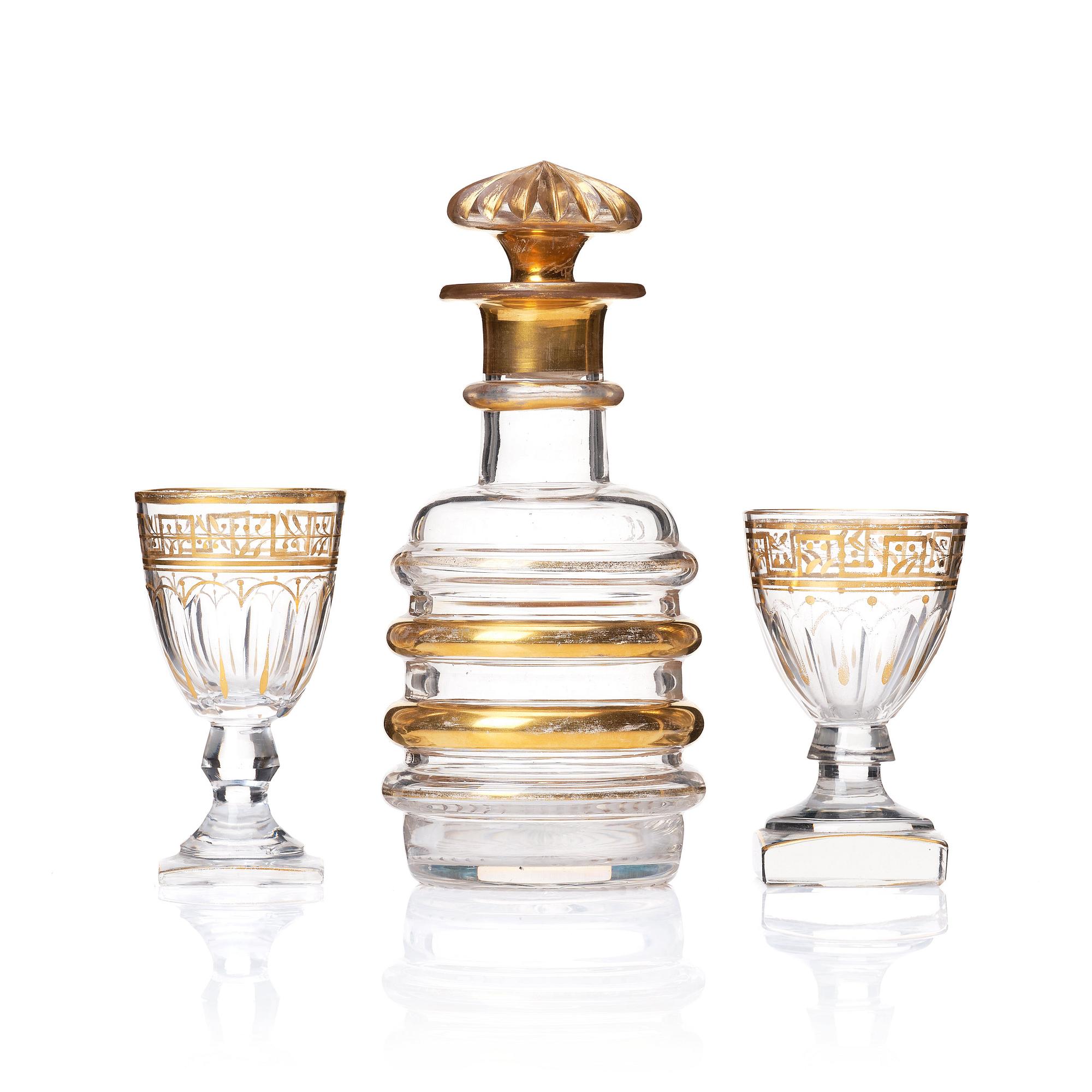 A set of Russian glasses (13 pcs.) and a bottle with stopper, 19th Century.