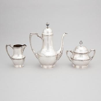 A Finnish Parcel-gilt Silver Art Nouveau Coffee Pot, Creamer and Sugarbowl, mark of Uusi Kultaseppä Oy, Helsinki 1912.