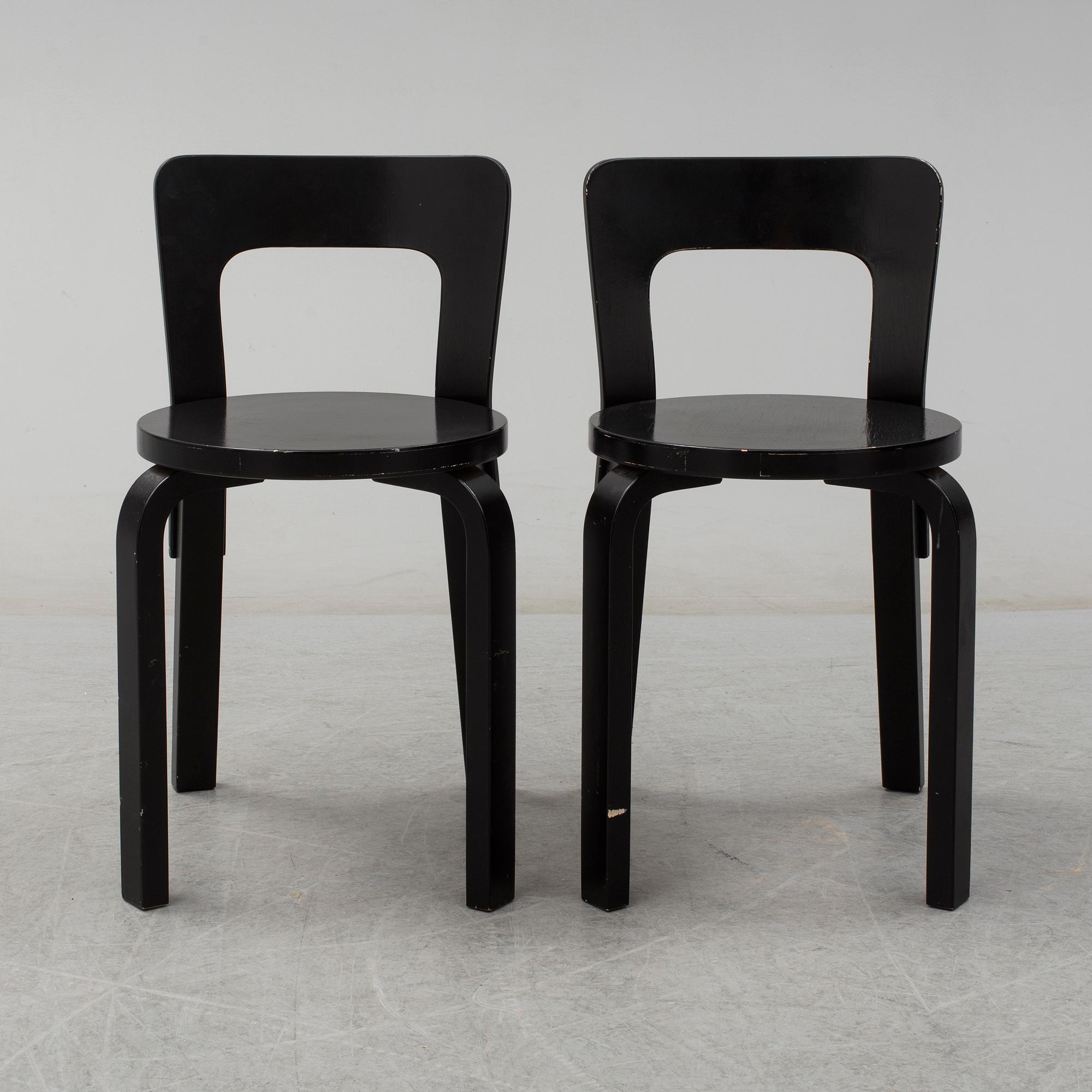 ALVAR AALTO, a pair of painted model 65 chairs from Artek, Finland.