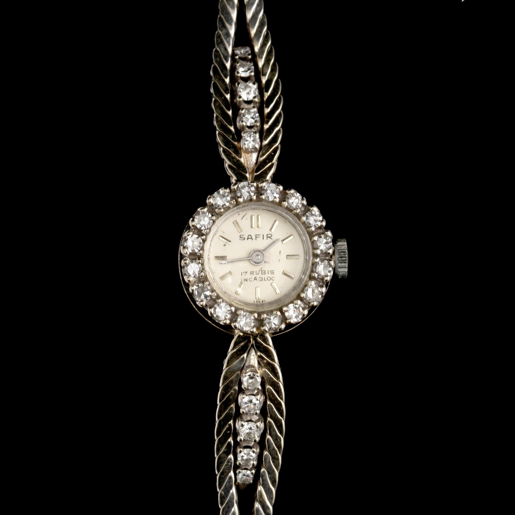 ARMBANDSUR, 18k vitguld med briljant och åttkantslipade diamanter, importstämplad. Vikt 22 g.