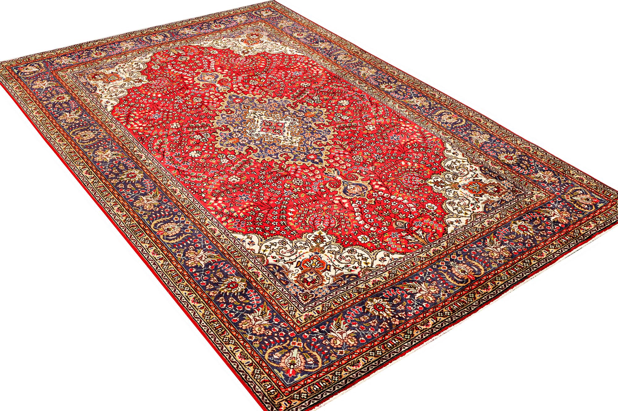 A Tabriz carpet, c 295 x 198 cm.