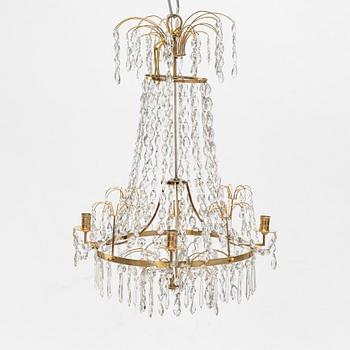 A Gustavian four-branch gilt-brass chandelier, Stockholm, late 18th century.