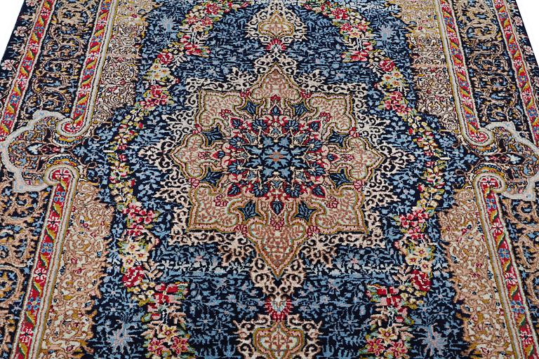 A Kerman Laver carpet, c. 252 x 150 cm.