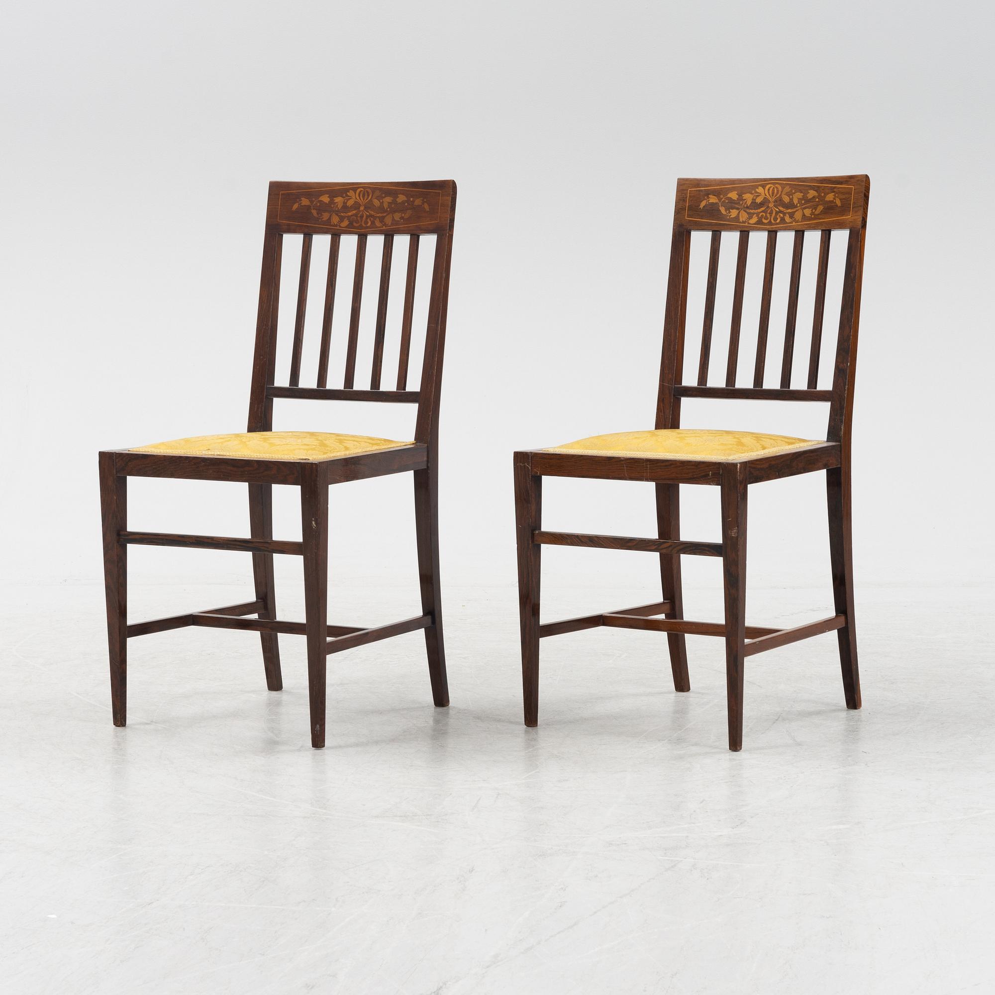 A group of five rosewood veneered chairs and a stool, mid 20th Century.