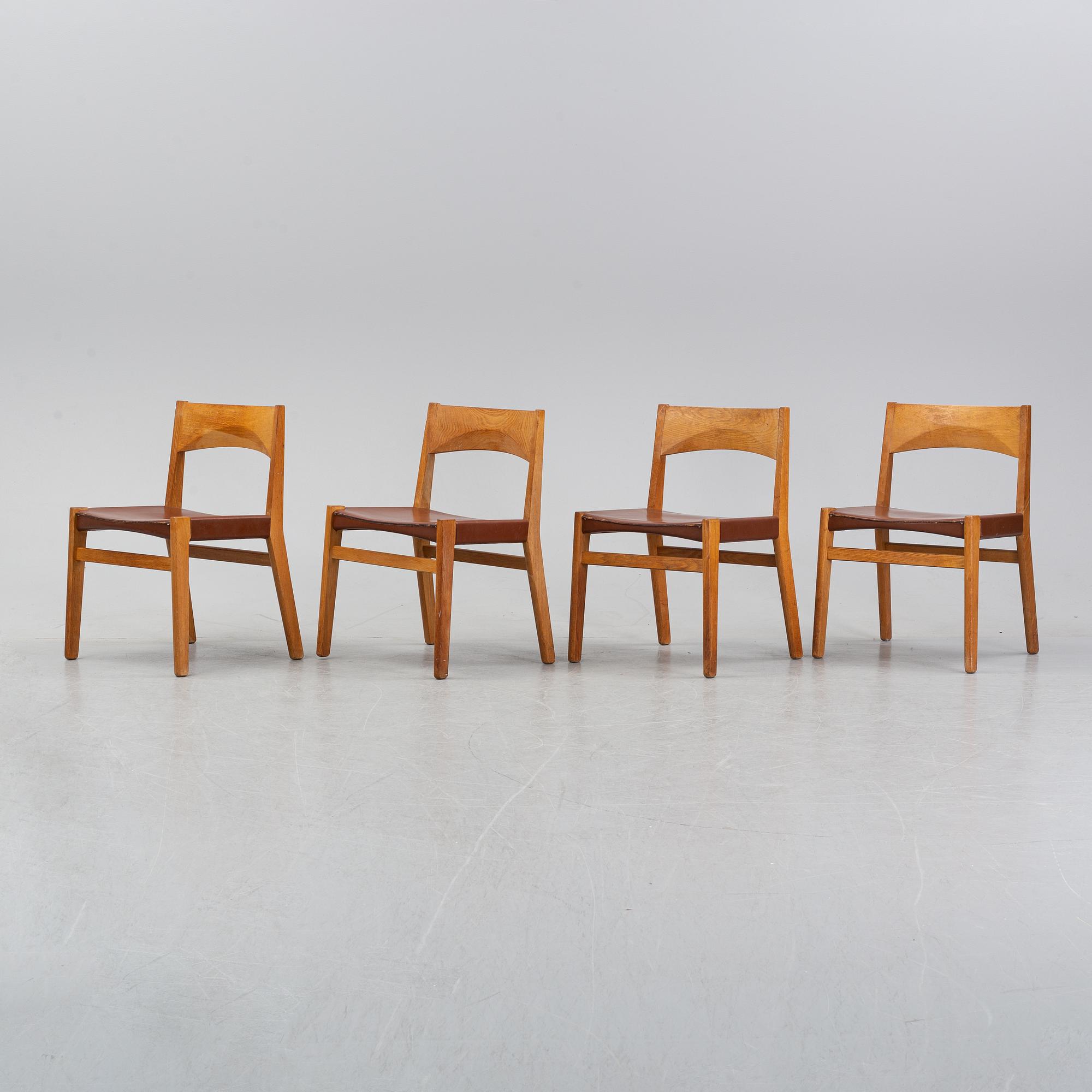 Four oak chairs with leather seat by John Vedel Rieper, Denmark, 1962.