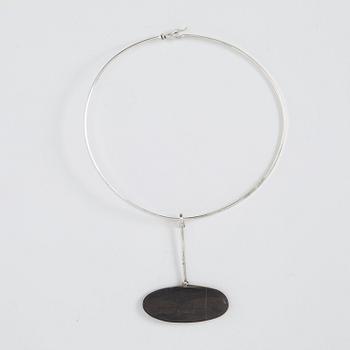 Vivianna Torun Bülow-Hübe, a silver necklace with a beach stone pendant, executed in her own workshop, Stockholm 1961.