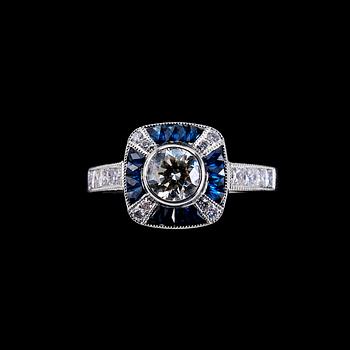 A RING, brilliant cut diamonds 1 x 0.51 ct. and 0.36 ct. Fancy cut sapphires.