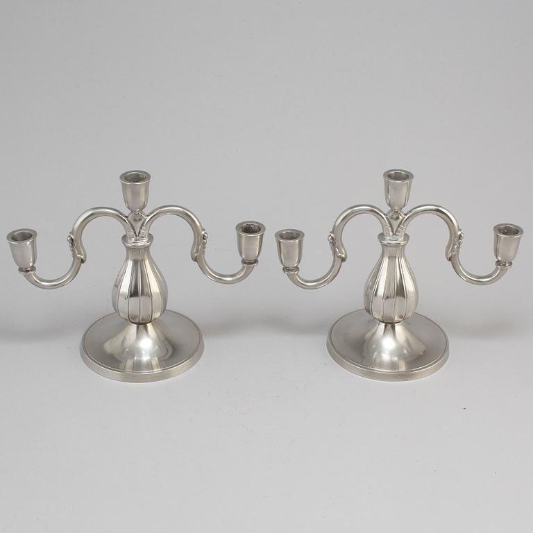 A pair of pewter candelabra from GAB Tenn, Stockholm, 1935.