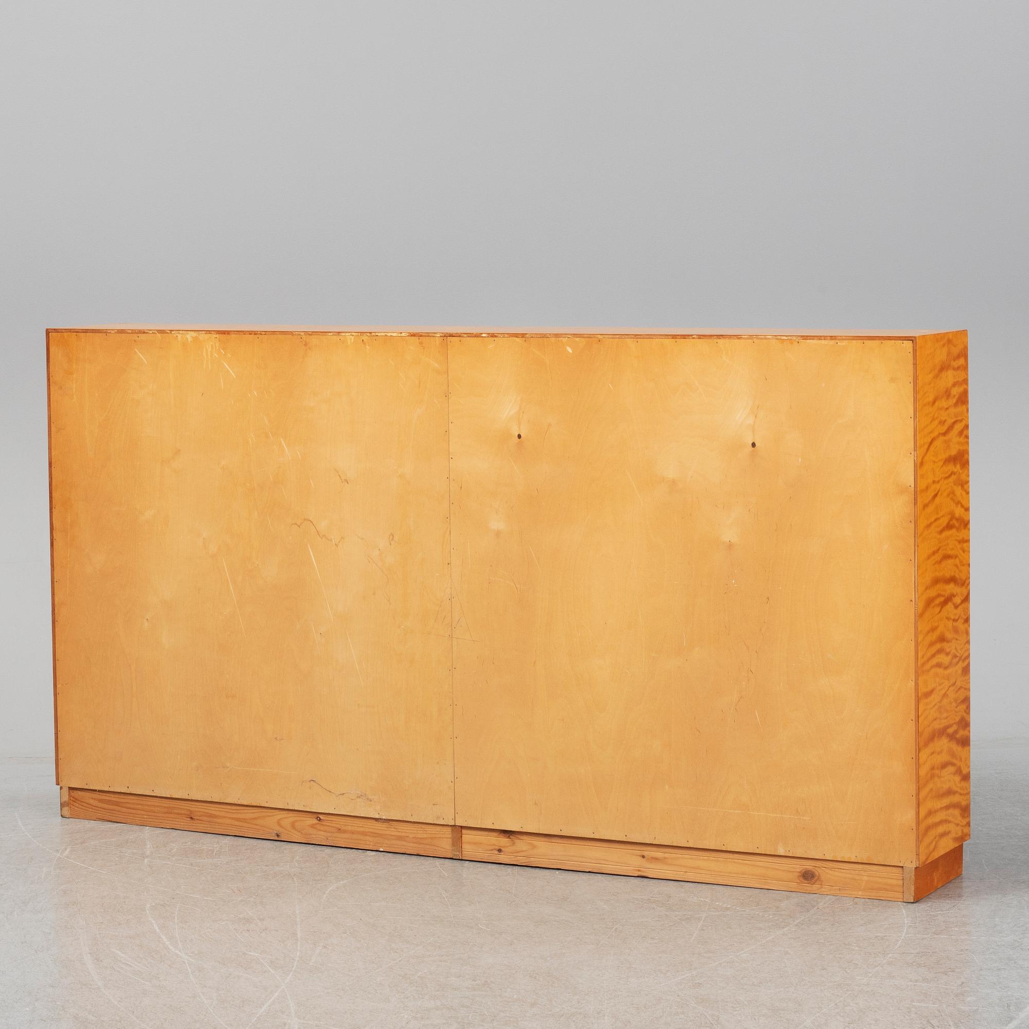 A 1940s birch veneered shelf.