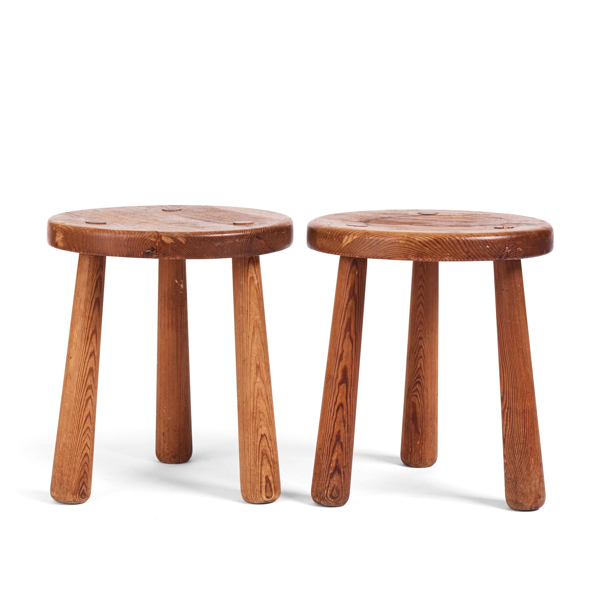 Axel Einar Hjorth, a pair of "Skoga" stained pine stools, Nordiska Kompaniet 1930s.