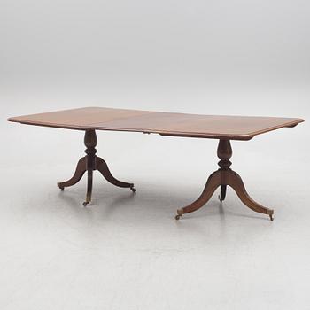 A two-part mahogany Georgian/Victorian dining table, England, first half of the 20th century.