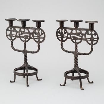 A pair of 1920s/1930s iron candelabres.