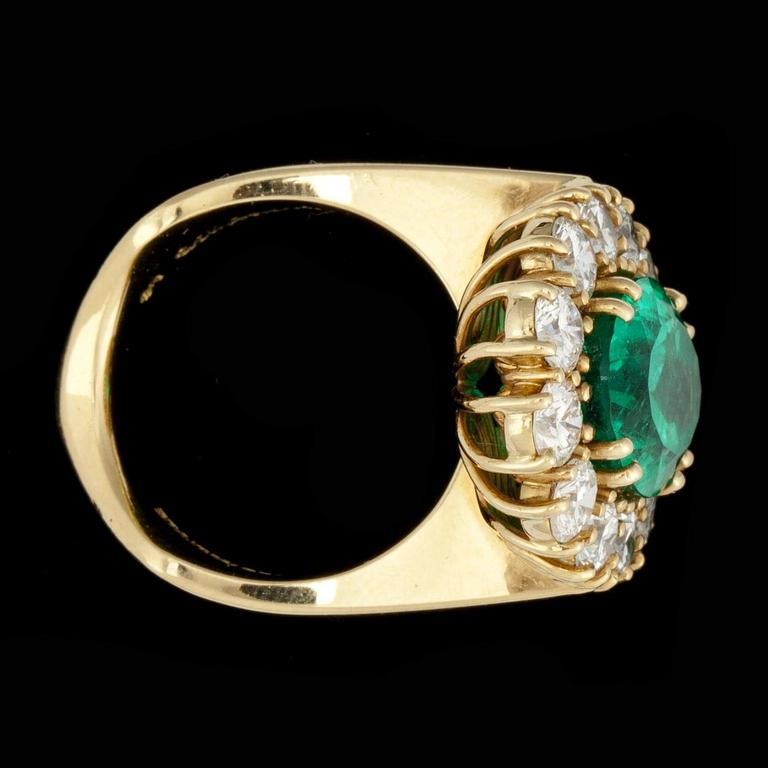 An emerald, 6.37 cts, and brilliant-cut diamonds, total carat weight circa 2.89 cts, ring.
