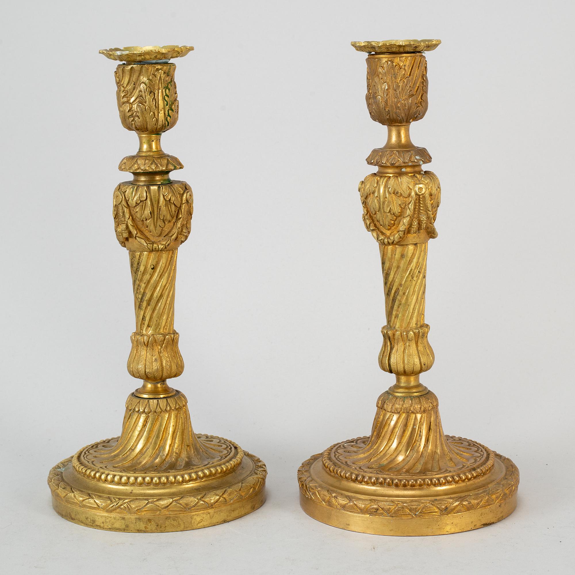 A pair of Louis XVI style candlesticks. Ca 1900.