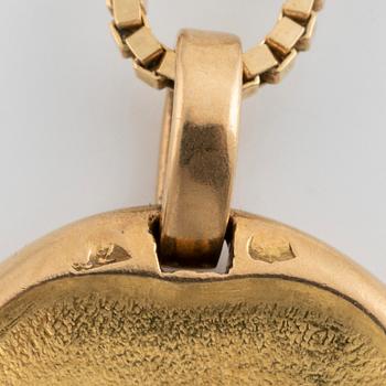 A Cartier Leo zodiac pendant.