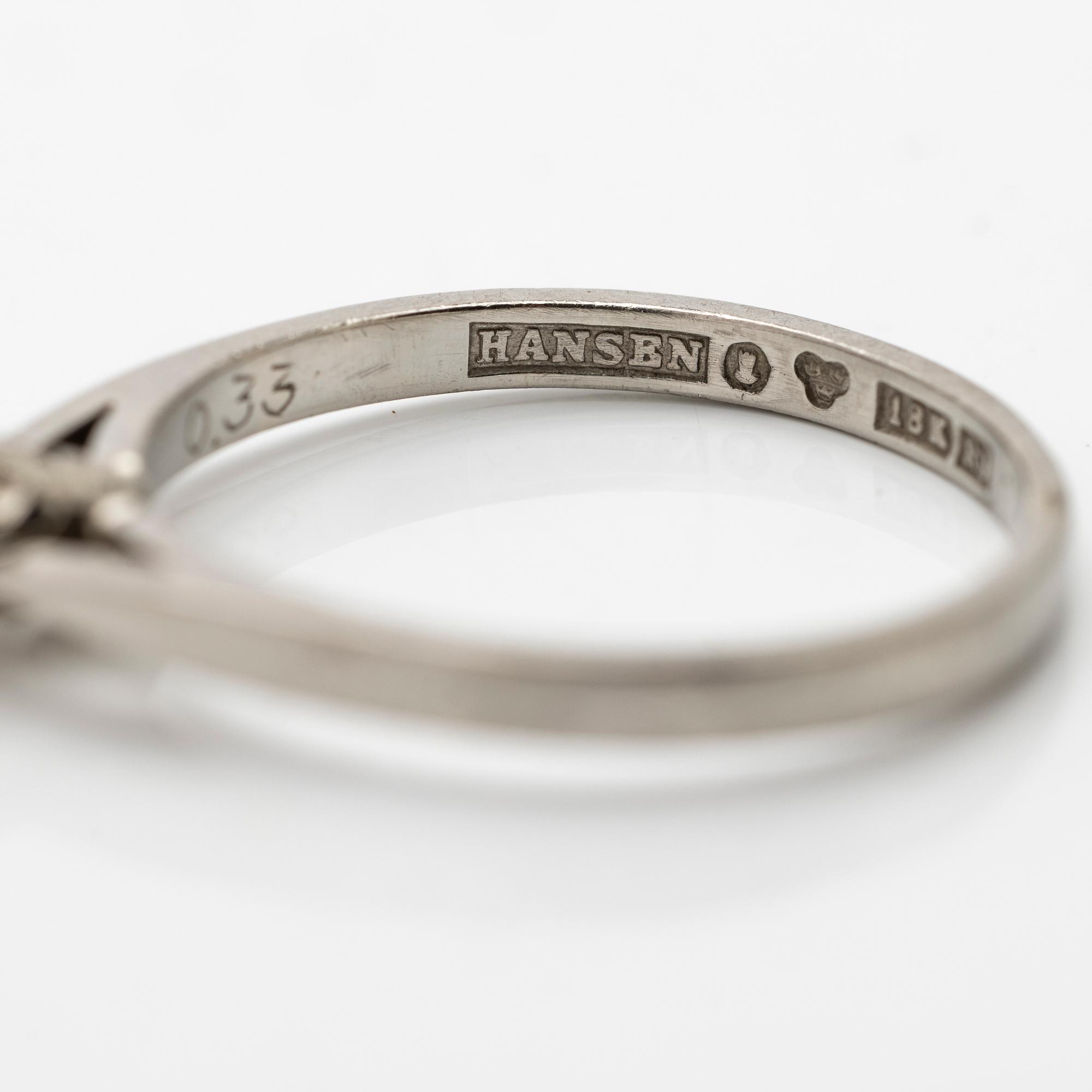 Solitaire ring in 18K white gold with one diamond.