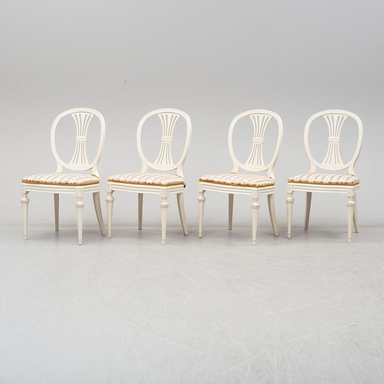 Four chairs with dinner table, late 20th Century.