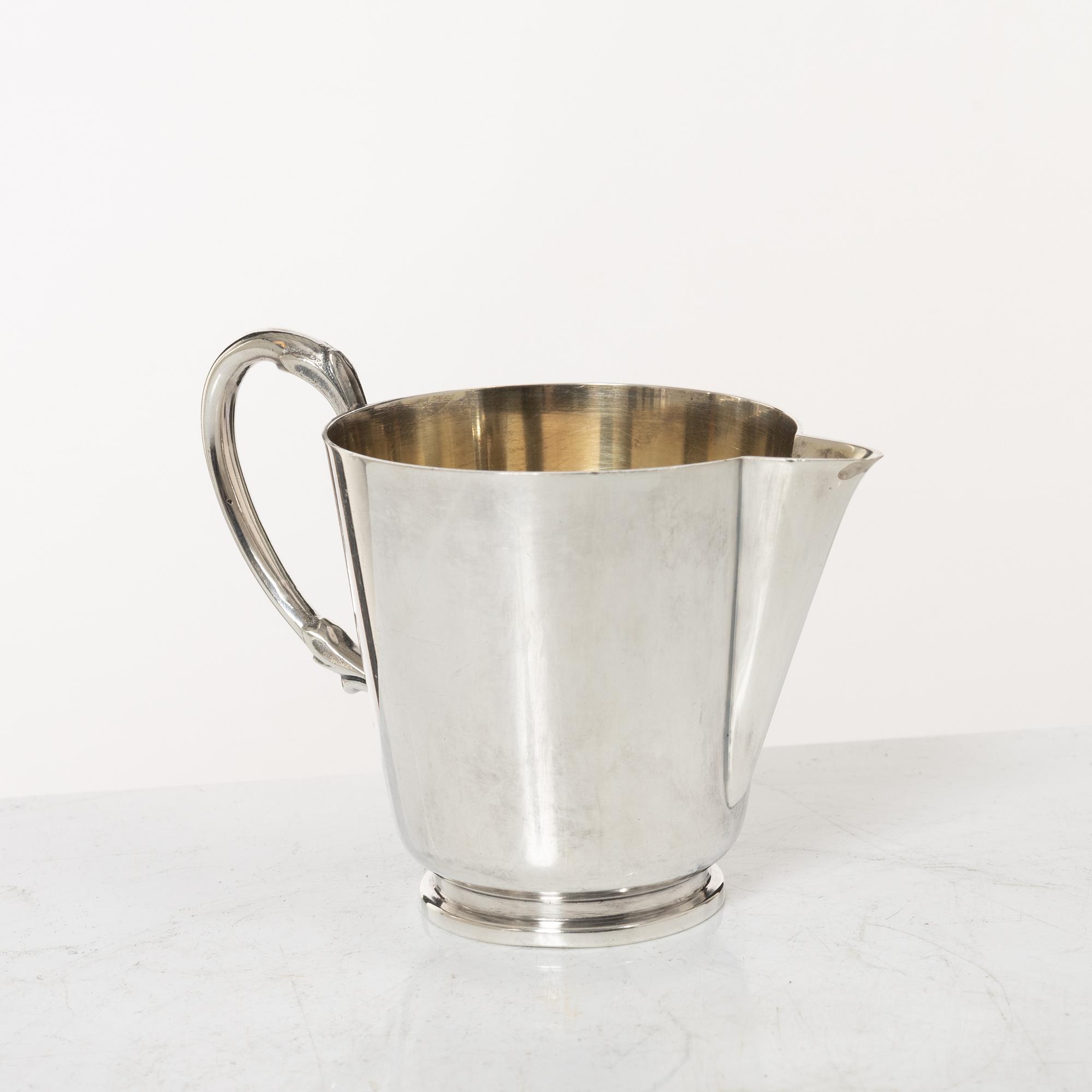 A 3-piece Swedish silver coffee service, marks of CG Hallberg, Stockholm 1947.