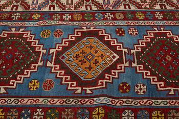 A RUG, a semi-antique Gendje probably, ca 209 x 124 cm.