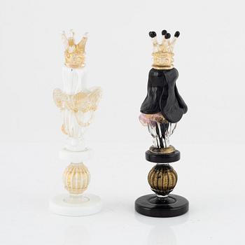 Two glass chess pieces, probably Murano, Italy.