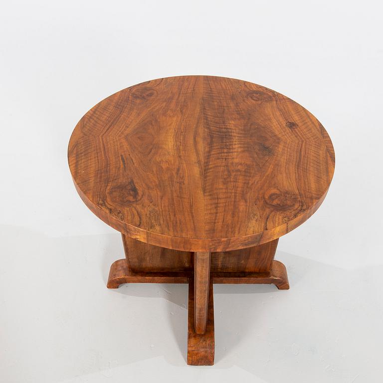 An Art Déco-style walnut table, manufactured in modern times.