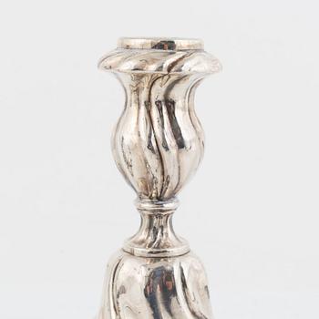 A pair of silver rococ-style candle sticks, presumably Germany, 20th century.