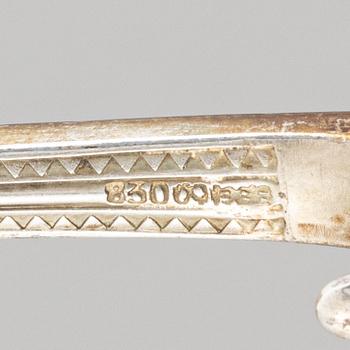 A pair of silver serving cutlery and a pair of sauce spoons, including Germany, early 20th century.