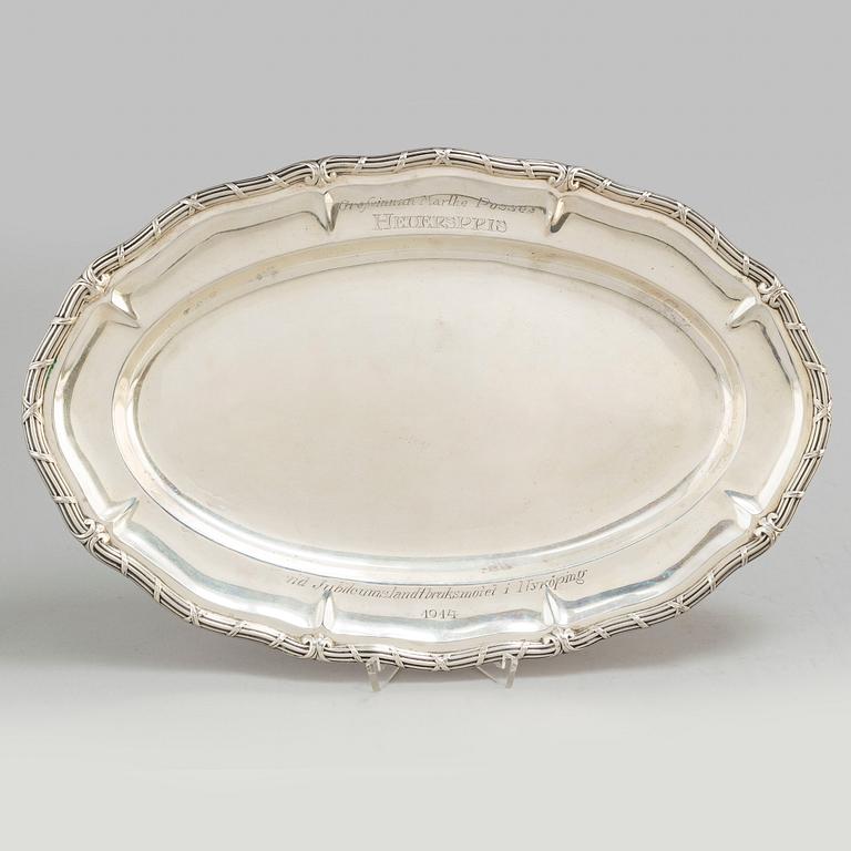 Two silver plates, including K Andersson, Stockholm, 1909 and 1914.