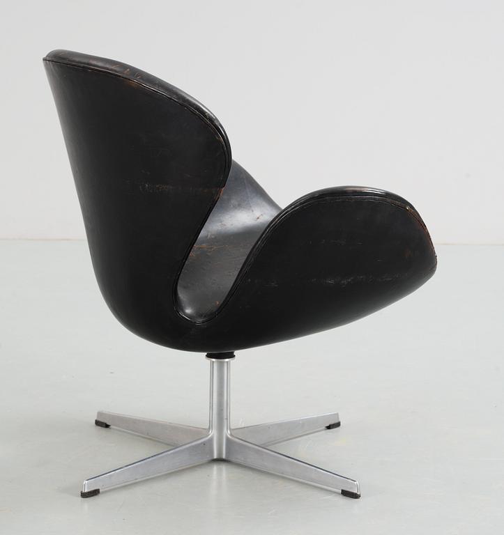 An Arne Jacobsen black leather 'Swan' easy chair, Fritz Hansen, Denmark 1960's.