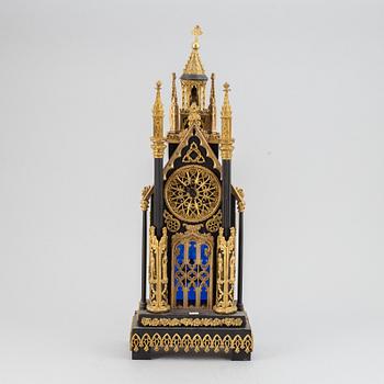 A gothic revival mantel clock.