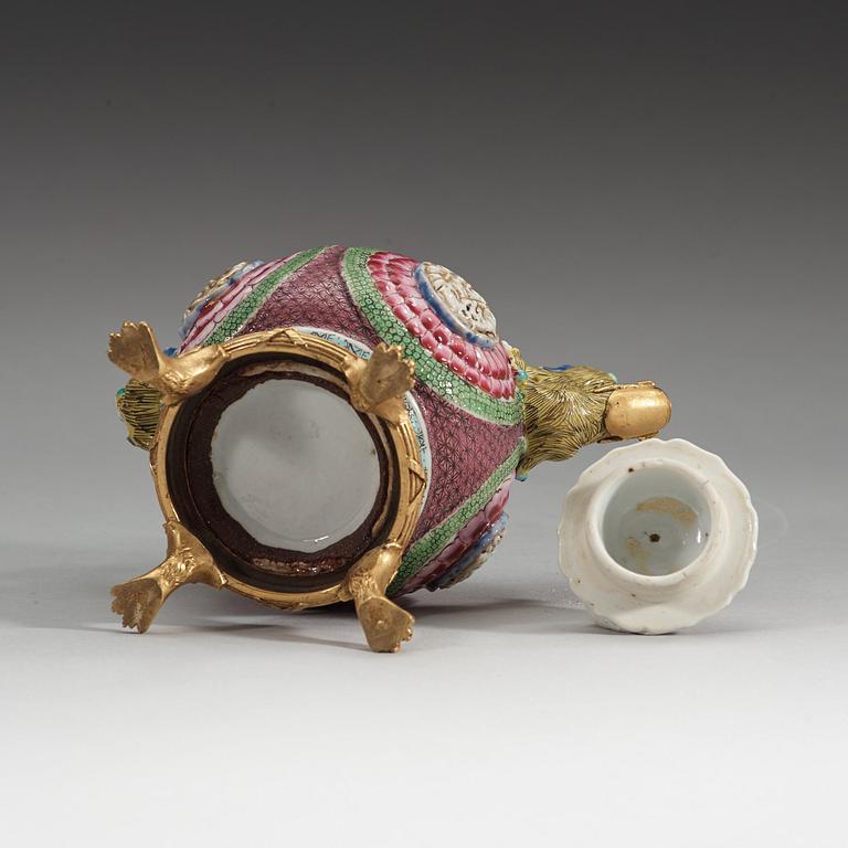 A gilt bronze mounted famille rose tea pot with cover, Qing dynasty, Yongzheng (1723-35).