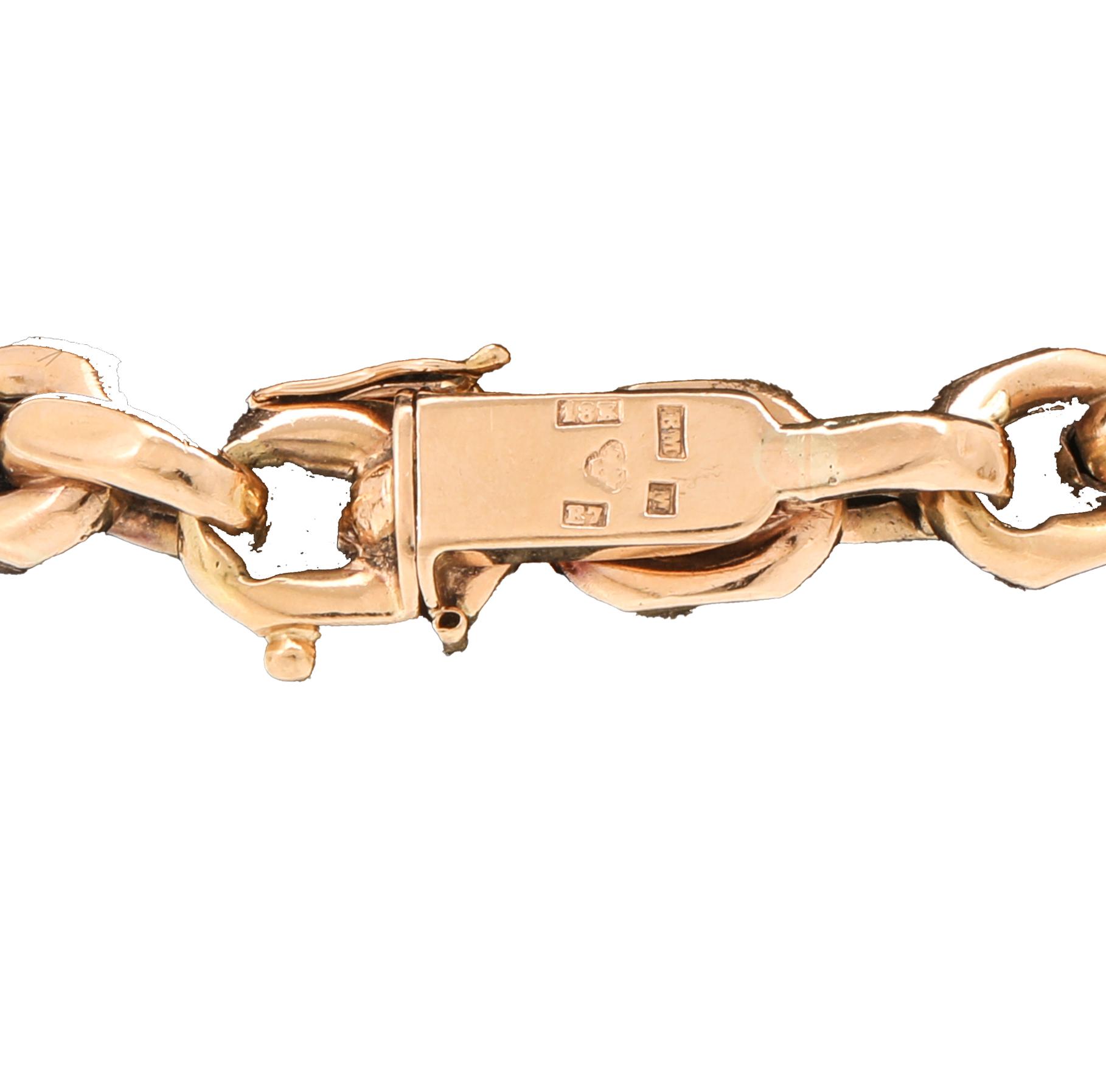 An 18K gold anchor link bracelet.
