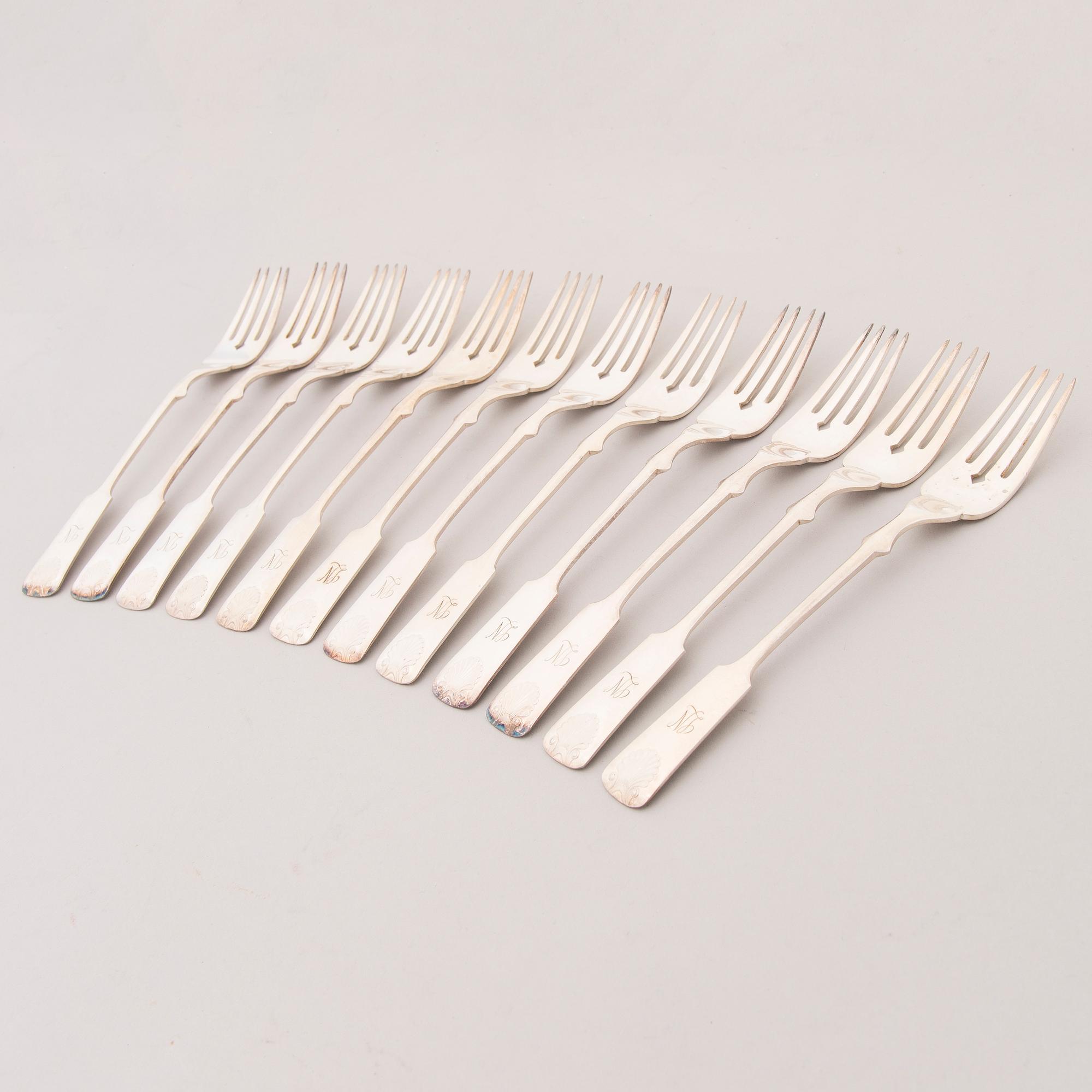 A set of 24 silver plate fish knives and forks with seashell decoration, Kultakeskus Oy, Finland 20th Century.