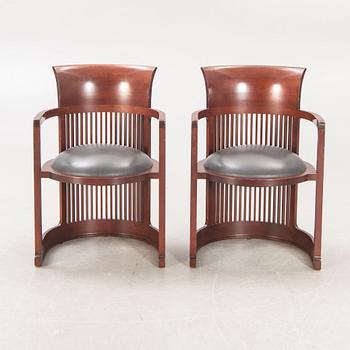 A pair of "606 Barrel Taliesin" armchairs by Frank Lloyd Wright for Cassina 1989, signed and numbered 28459, 28581.