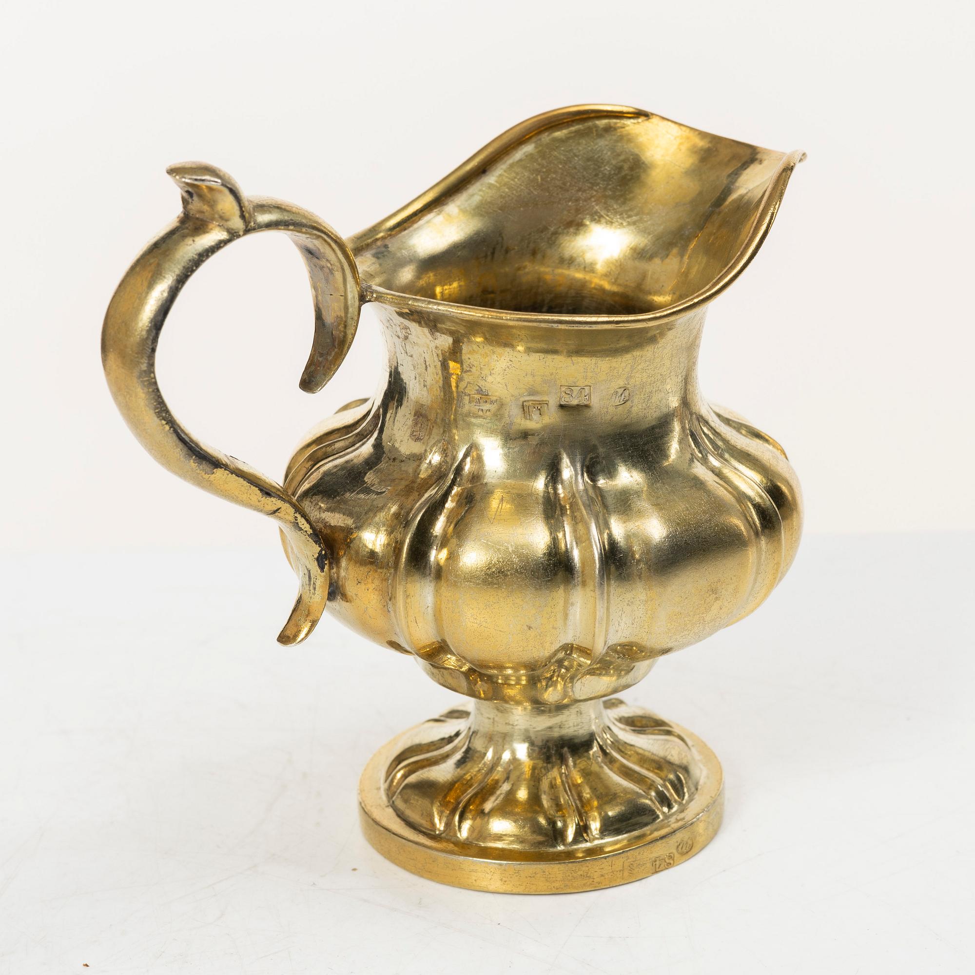 A Russian silver-gilt cream jug, Minsk, 1860s.