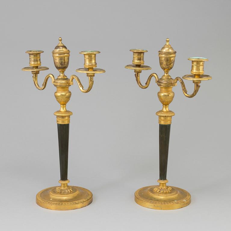A pair of French Directoire late 18th century ormolu candelabra for three candles.