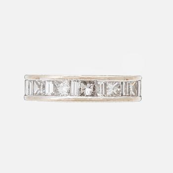 An 18K white gold eternity ring set with baguette and princess cut diamonds by Hartmann's Denmark.