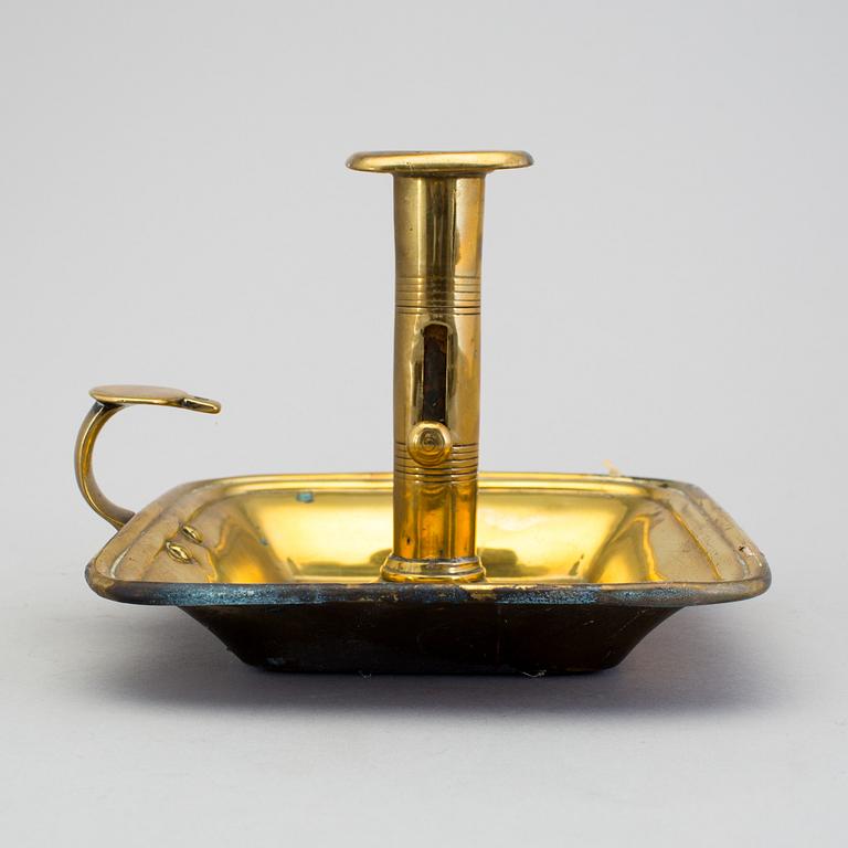 A 19th century brass candlestick.